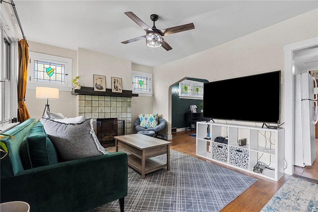 107 Imogene Rd, Greenfield, PA 15217 - living area with a ceiling fan, a fireplace, and wood finished floors