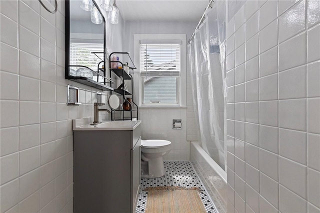 107 Imogene Rd, Greenfield, PA 15217 - full bath with tile walls, vanity, shower / bath combo with shower curtain, and tile patterned floors