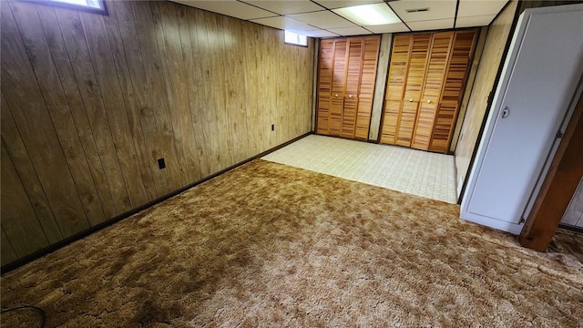 881 Bonniebrook Rd, City Of But Nw, PA 16002 - basement featuring carpet floors, wooden walls, and a drop ceiling