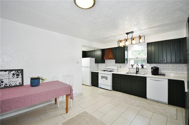 404 Emerson, Munhall, PA 15120 - kitchen with white appliances, tasteful backsplash, light countertops, decorative light fixtures, and a chandelier