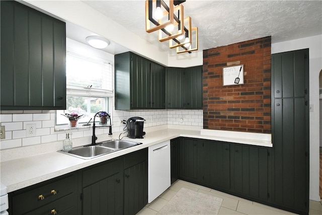 404 Emerson, Munhall, PA 15120 - kitchen featuring white dishwasher, decorative backsplash, light countertops, and light tile patterned floors