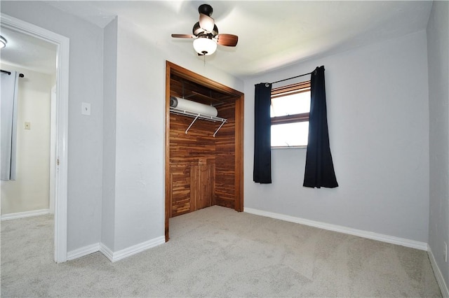404 Emerson, Munhall, PA 15120 - unfurnished bedroom with carpet flooring, a closet, a ceiling fan, and wood walls