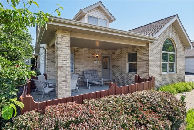166 Steeplechase Cir, West Deer, PA 15044 - view of front of property with brick siding and a porch