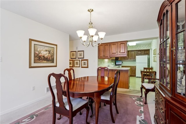 166 Steeplechase Cir, West Deer, PA 15044 - dining space featuring carpet flooring and a chandelier