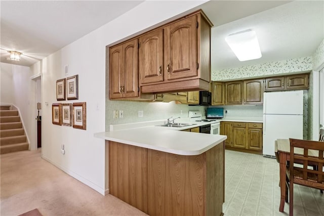 166 Steeplechase Cir, West Deer, PA 15044 - kitchen featuring white appliances, a peninsula, light countertops, and brown cabinetry