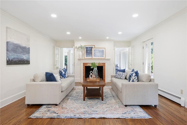 143 N Dr, Fox Chapel, PA 15238 - living area with baseboard heating, ornamental molding, a fireplace, wood finished floors, and recessed lighting