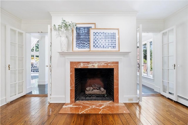 143 N Dr, Fox Chapel, PA 15238 - detailed view of wood finished floors, a premium fireplace, ornamental molding, and french doors