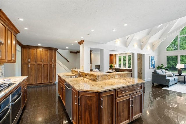 143 N Dr, Fox Chapel, PA 15238 - kitchen featuring open floor plan, appliances with stainless steel finishes, light stone countertops, recessed lighting, and granite floors