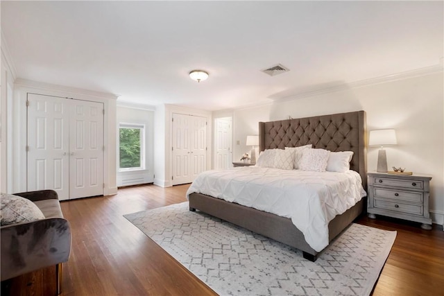 143 N Dr, Fox Chapel, PA 15238 - bedroom featuring crown molding, wood finished floors, and two closets