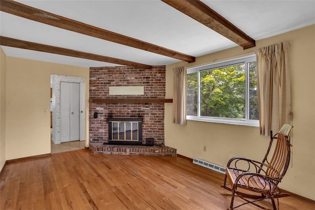 1449 Parkview Dr, Mccandless, PA 15101 - unfurnished living room featuring beamed ceiling, wood finished floors, and a fireplace