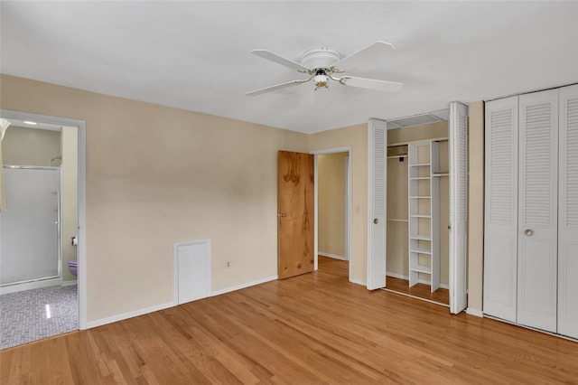 1449 Parkview Dr, Mccandless, PA 15101 - unfurnished bedroom with two closets, light wood-type flooring, ensuite bathroom, and ceiling fan