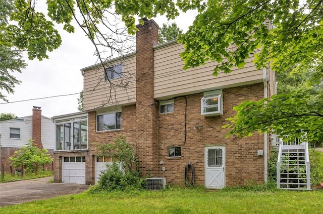 1449 Parkview Dr, Mccandless, PA 15101 - view of side of property with driveway, brick siding, an attached garage, and a chimney