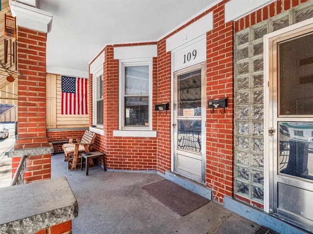 109 Ella St, Mckees Rocks, PA 15136 - property entrance featuring a porch and brick siding