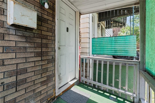 302 38th St, Lawrenceville, PA 15201 - property entrance featuring brick siding and covered porch