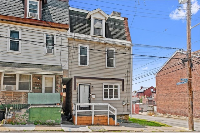 302 38th St, Lawrenceville, PA 15201 - view of front of house featuring mansard roof, roof with shingles, and a chimney