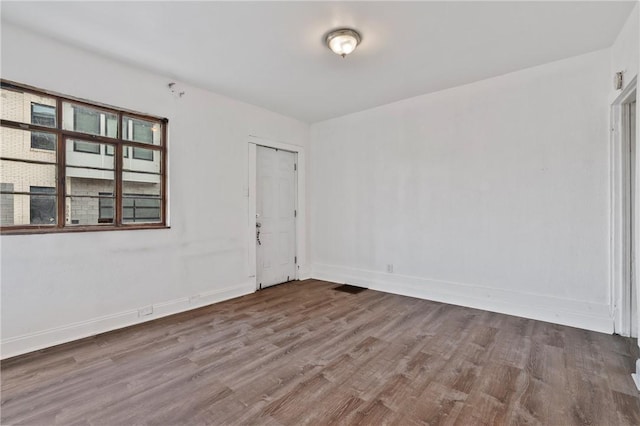 302 38th St, Lawrenceville, PA 15201 - spare room with wood finished floors and baseboards