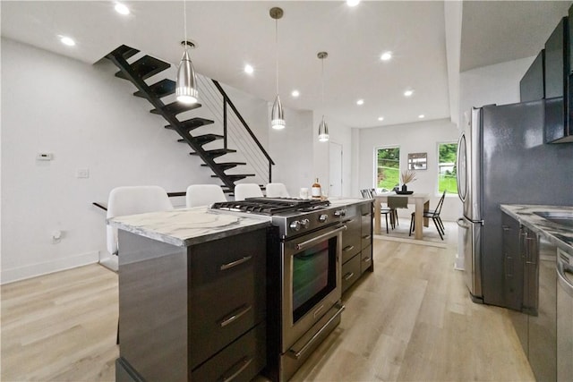 2613 Stella St, South Side, PA 15203 - kitchen featuring appliances with stainless steel finishes, a kitchen island, light wood-style floors, modern cabinets, and recessed lighting
