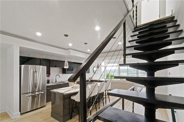 2613 Stella St, South Side, PA 15203 - stairs featuring wood finished floors and recessed lighting