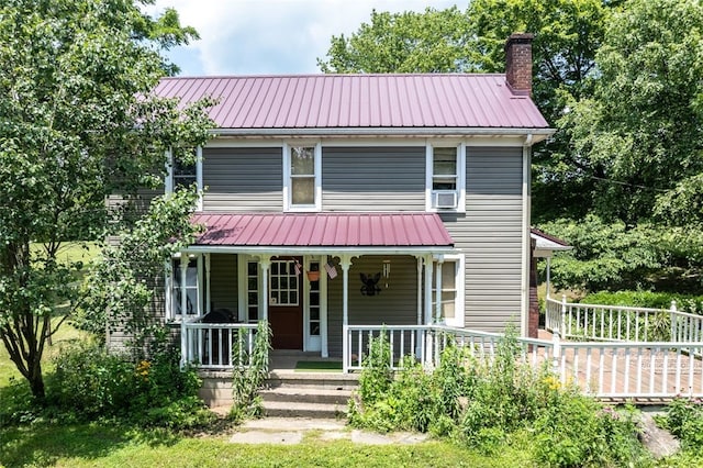 1345 N Tower Rd, Perry Twp, PA 16123 - view of front facade featuring a metal roof, a chimney, and covered porch