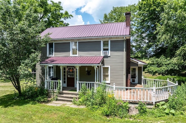 1345 N Tower Rd, Perry Twp, PA 16123 - view of front facade featuring a chimney, a porch, a metal roof, and a front yard