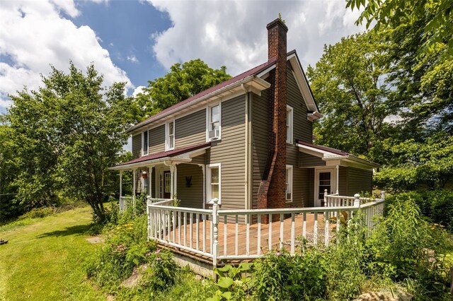 1345 N Tower Rd, Perry Twp, PA 16123 - view of side of home featuring a yard, a chimney, and a deck