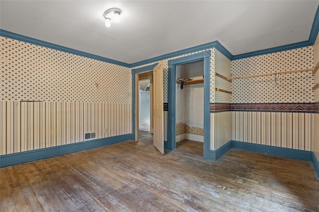1345 N Tower Rd, Perry Twp, PA 16123 - unfurnished bedroom with wallpapered walls, hardwood / wood-style floors, and ornamental molding
