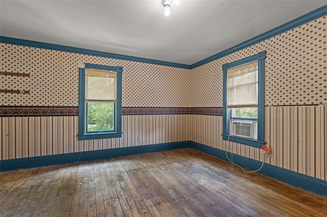 1345 N Tower Rd, Perry Twp, PA 16123 - spare room featuring wallpapered walls, hardwood / wood-style flooring, plenty of natural light, ornamental molding, and cooling unit