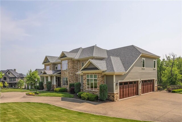 106 Orchard Dr, Pine Twp, PA 15044 - craftsman inspired home with a garage, concrete driveway, stone siding, and roof with shingles