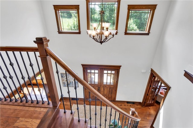 106 Orchard Dr, Pine Twp, PA 15044 - staircase with a chandelier, wood finished floors, plenty of natural light, and a high ceiling