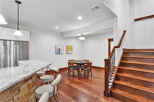 106 Orchard Dr, Pine Twp, PA 15044 - dining room featuring stairs, dark wood-type flooring, and recessed lighting