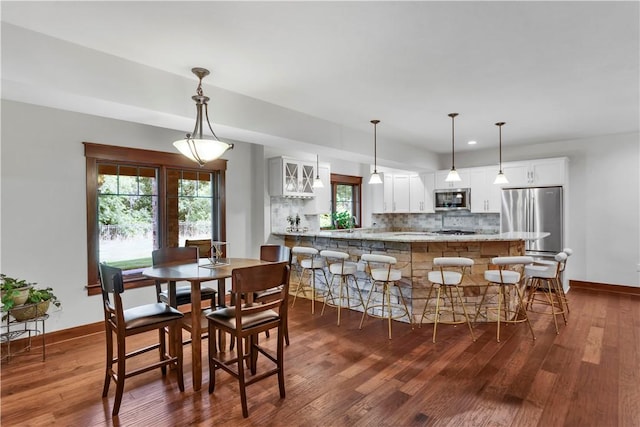 106 Orchard Dr, Pine Twp, PA 15044 - dining space featuring dark wood finished floors and plenty of natural light