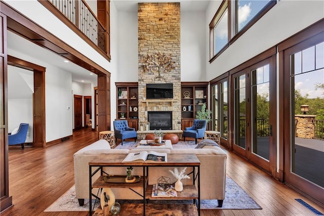 106 Orchard Dr, Pine Twp, PA 15044 - living room featuring a high ceiling, hardwood / wood-style flooring, and a fireplace