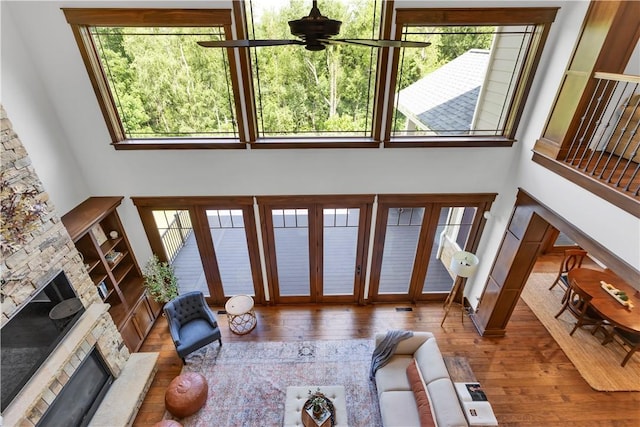 106 Orchard Dr, Pine Twp, PA 15044 - living area featuring a ceiling fan, hardwood / wood-style floors, and a stone fireplace