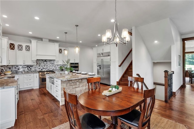 106 Orchard Dr, Pine Twp, PA 15044 - dining space featuring dark wood-style flooring, stairway, recessed lighting, and a chandelier