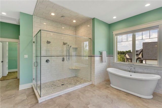 106 Orchard Dr, Pine Twp, PA 15044 - bathroom featuring a shower stall, a freestanding bath, recessed lighting, and tile walls