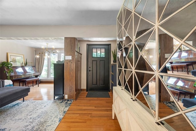 5671 Beacon St, Squirrel Hill, PA 15217 - foyer with wood finished floors and a chandelier