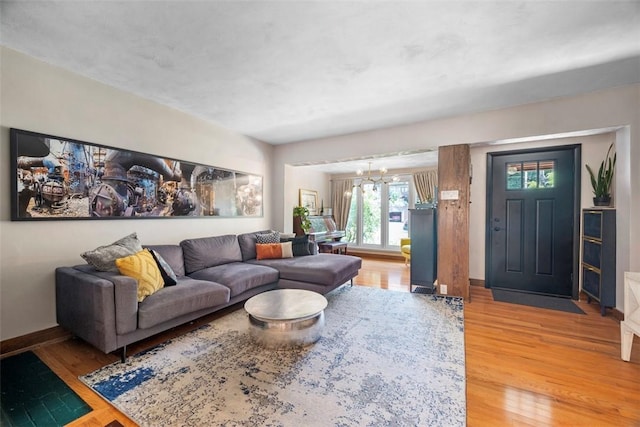 5671 Beacon St, Squirrel Hill, PA 15217 - living room with light wood-style flooring and a chandelier