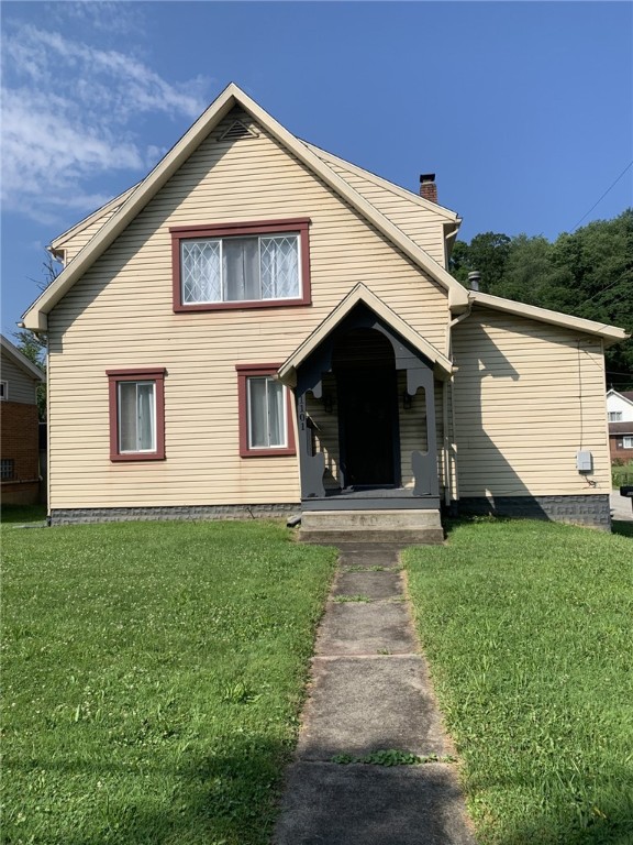 1101 State Route 356, Allegheny Twp, PA 15656 - view of front of home featuring a front lawn and a chimney