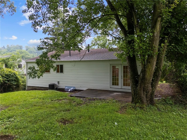 260 Stotler Rd, Penn Hills, PA 15235 - rear view of property with a lawn, a patio area, french doors, and a shingled roof