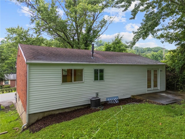 260 Stotler Rd, Penn Hills, PA 15235 - rear view of house featuring a lawn, a patio, roof with shingles, and french doors