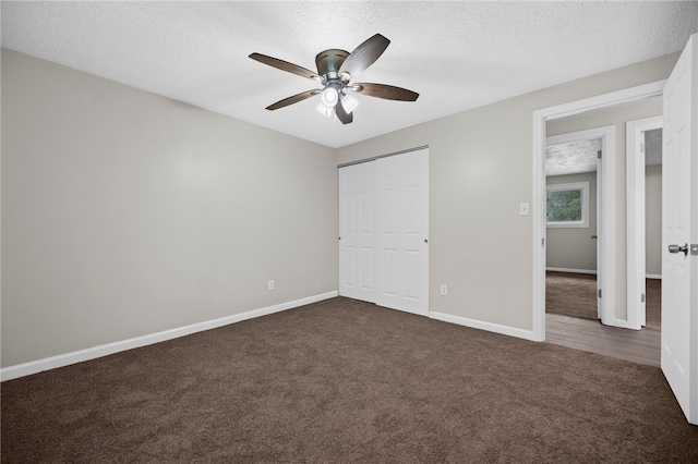 260 Stotler Rd, Penn Hills, PA 15235 - unfurnished bedroom with dark carpet, a textured ceiling, a closet, and a ceiling fan