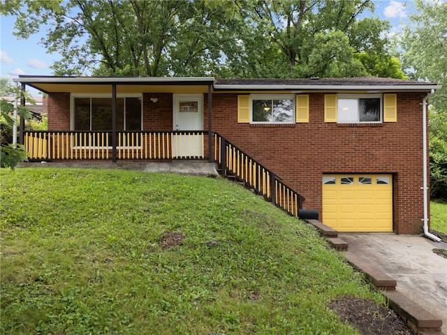 260 Stotler Rd, Penn Hills, PA 15235 - ranch-style house featuring a garage, brick siding, a front yard, concrete driveway, and a porch