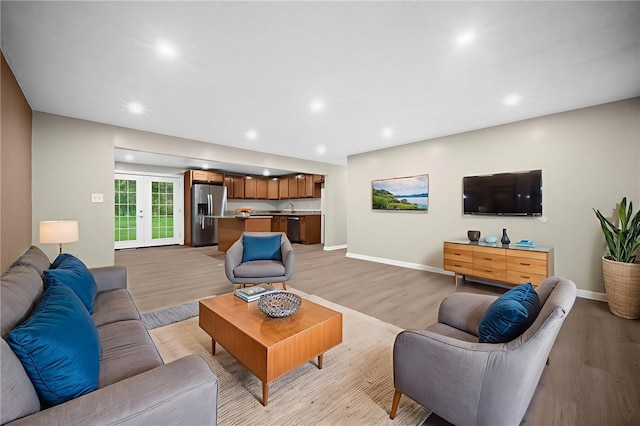 260 Stotler Rd, Penn Hills, PA 15235 - living area featuring light wood-type flooring, french doors, and recessed lighting