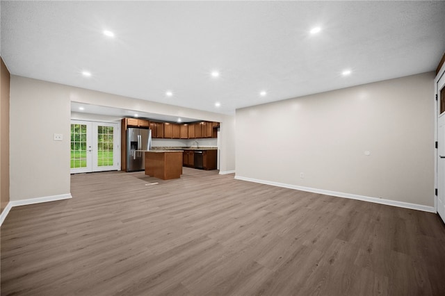 260 Stotler Rd, Penn Hills, PA 15235 - unfurnished living room with light wood-type flooring and recessed lighting