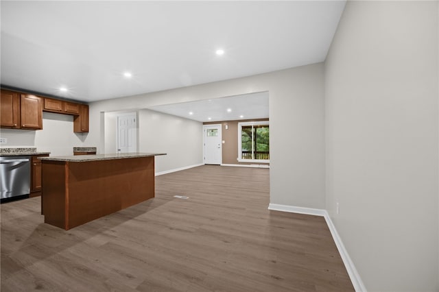 260 Stotler Rd, Penn Hills, PA 15235 - kitchen with stainless steel dishwasher, recessed lighting, wood finished floors, a center island, and light stone counters