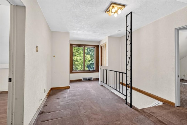 3650 Gibsonia Rd, Richland, PA 15044 - corridor featuring carpet flooring, a textured ceiling, and an upstairs landing