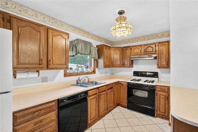 3650 Gibsonia Rd, Richland, PA 15044 - kitchen featuring gas range oven, black dishwasher, under cabinet range hood, freestanding refrigerator, and brown cabinets