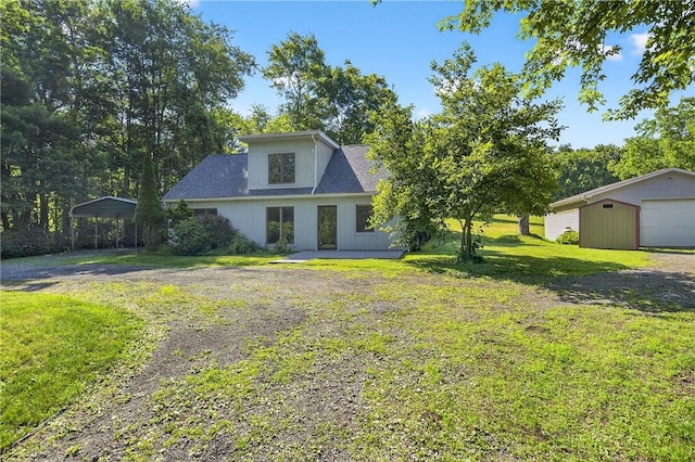 3650 Gibsonia Rd, Richland, PA 15044 - view of front facade featuring dirt driveway, a front lawn, an outdoor structure, a carport, and a garage