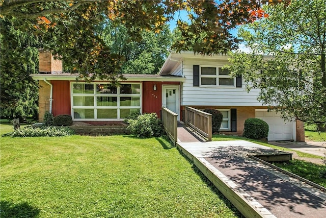 469 Koonce Rd, Hermitage, PA 16148 - split level home with a front lawn, a garage, driveway, and a chimney