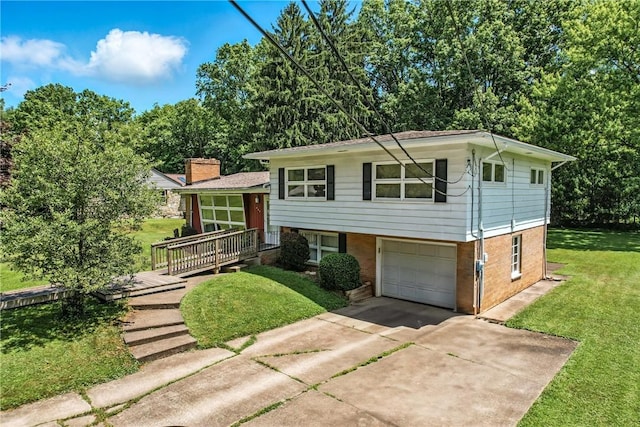 469 Koonce Rd, Hermitage, PA 16148 - split level home with concrete driveway, a front lawn, a garage, and brick siding
